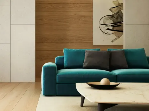 Wohnzimmer mit Sofa in Petrol und Holzvertäfelung